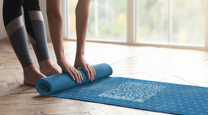 Mockup of a Woman Rolling Up a Yoga Mat