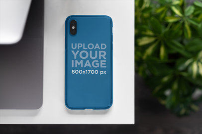 Phone Case Mockup Featuring Some Plants in the Background