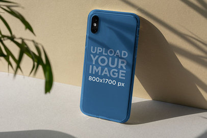 Mockup of a Clear Phone Case Placed Against a Wall