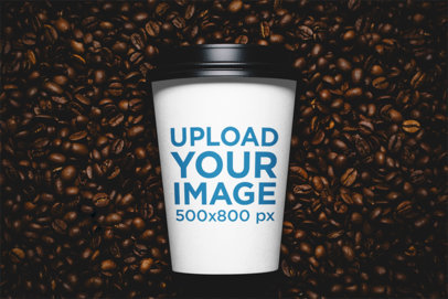 Mockup of a Customizable Paper Cup Surrounded by Coffee Beans 