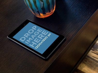 Nexus 7 Mockup Featuring a Dark Table and a Vase