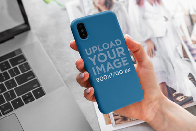 Mockup of a Woman Holding a Phone Case for iPhone