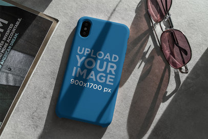 Mockup of a Phone Case Placed Next to a Pair of Sunglasses 4617-el1