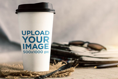 Mockup of a Paper Cup Placed over a Wicker Piece 36655-r-el2