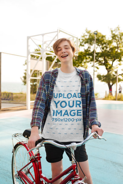 Heathered T-Shirt Mockup Featuring a Happy Young Man with a Bicycle 