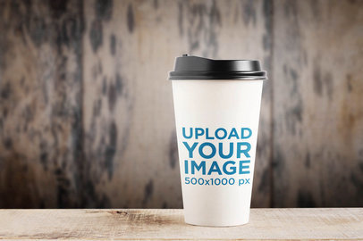 Mockup of a Paper Cup Placed over a Wooden Surface