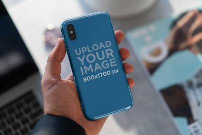 Mockup of a Man Holding a Clear Phone Case