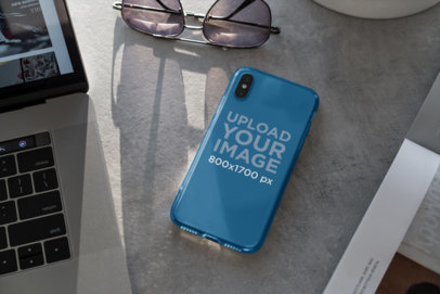 Mockup of a Clear Phone Case Placed Next to a Pair of Sunglasses 4639-el1