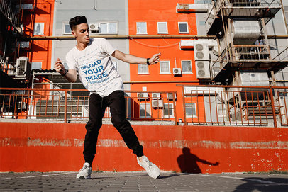 Mockup of a Breakdancer Wearing a T-Shirt on the Street