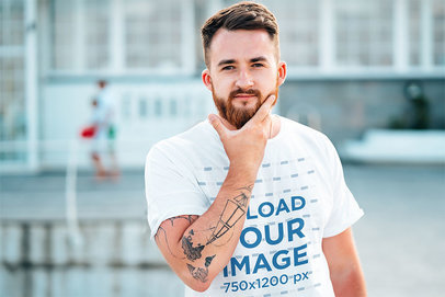 T-Shirt Mockup Featuring a Man Touching His Beard
