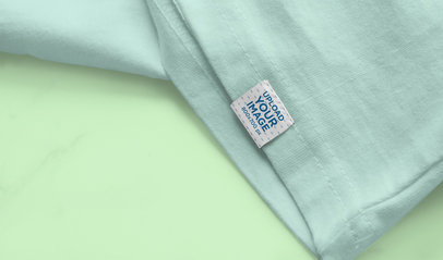 Sleeve Label Mockup Featuring a T-Shirt on a Flat Surface 4661-el1
