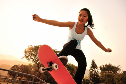 Tank Top Mockup of a Woman Riding Her Skateboard