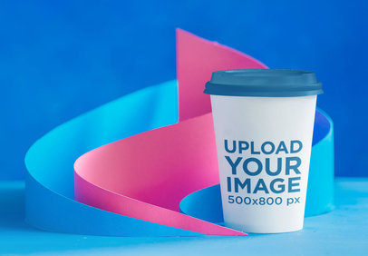 Mockup of a Coffee Cup Featuring Paper Crafts