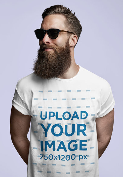 Mockup of a Bearded Man Wearing a T-Shirt in a Studio