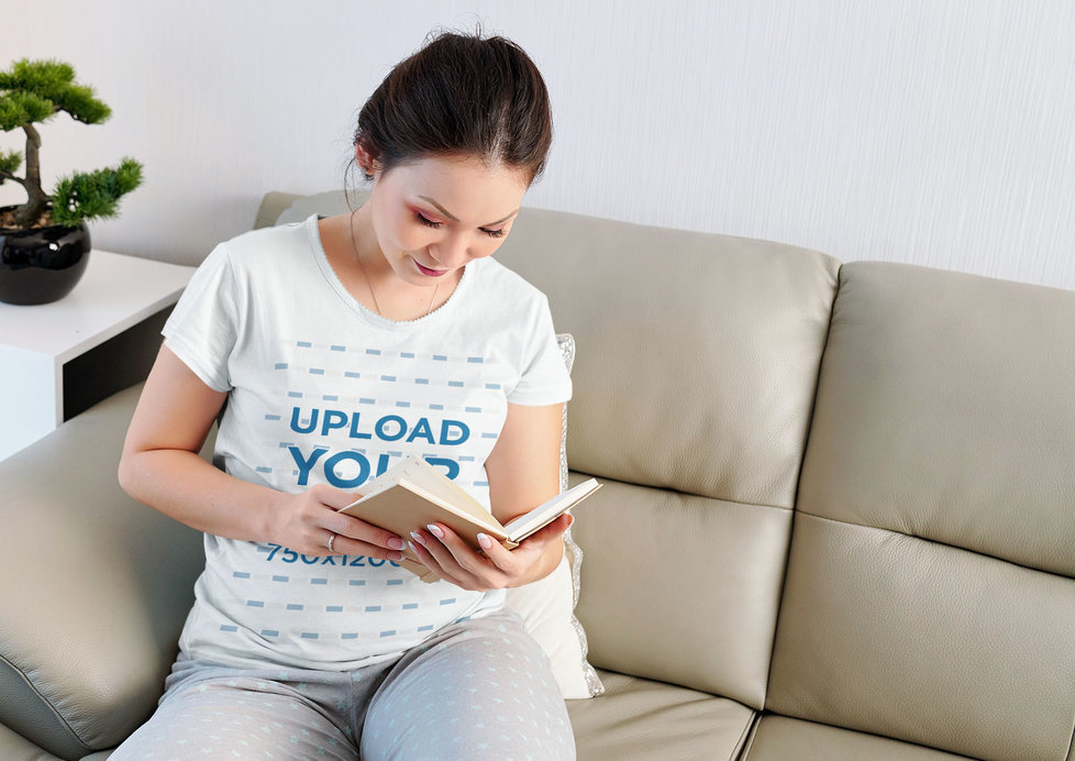 T-Shirt Mockup Featuring a Pregnant Woman Reading