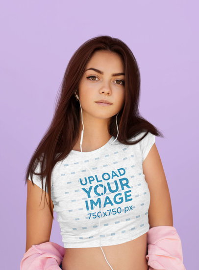 Mockup of a Woman Wearing a Heather Crop Top Against a Solid Color Background