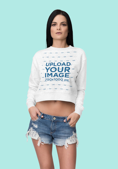 Mockup of a Serious Woman Wearing a Heather Crop Top Sweatshirt at a Studio 