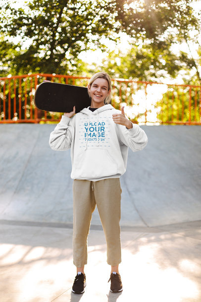 Hoodie Mockup Featuring a Happy Teenager at a Skatepark