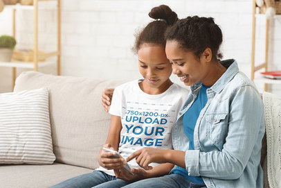 T-Shirt Mockup of a Girl and Her Mom Looking at a Phone 