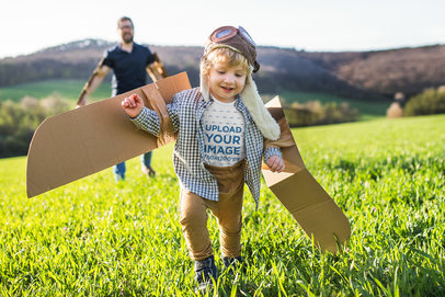 T-Shirt Mockup of a Little Boy Playing with His Father Outside