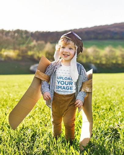 Mockup of a Little Boy Wearing a T-Shirt While Playing Outside