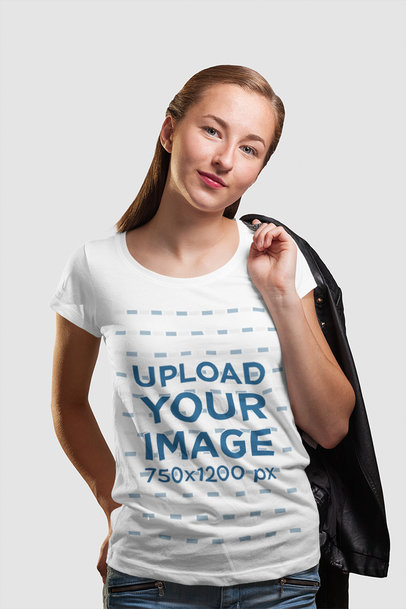 Round Neck Tee Mockup of a Woman Carrying a Garment on Her Shoulder
