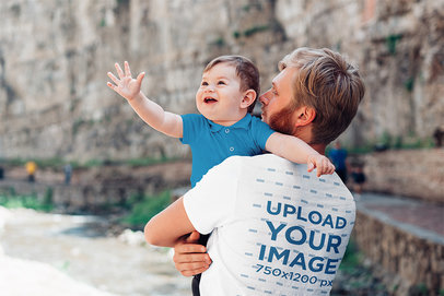 Back-View T-Shirt Mockup of a Man Holding His Baby Boy
