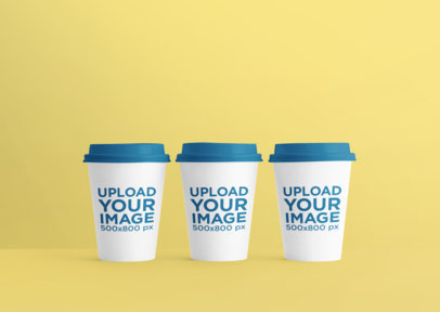Mockup of Three Coffee Cups Placed Against a Plain Color Backdrop 36891-r-el2