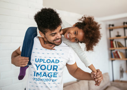 T-Shirt Mockup of a Father Carrying His Kid on His Shoulders