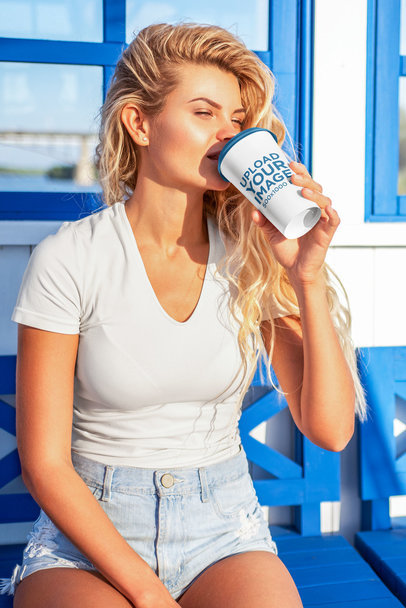 Mockup of a Woman Drinking From a Coffee Cup