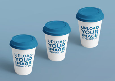 Mockup Featuring Three Customizable Coffee Cups on a Solid Color Surface