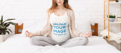 Tank Top Mockup Featuring a Pregnant Woman Meditating in Bed