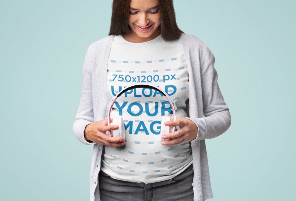 T-Shirt Mockup of a Pregnant Woman Sharing Music with Her Child