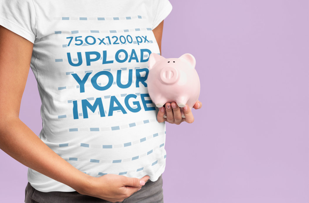 T-Shirt Mockup of a Pregnant Woman Holding a Piggy Bank 