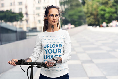 Long-Sleeve Mockup Featuring a Woman with a Bicycle on the Street