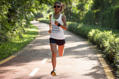 Tank Top Mockup Featuring a Woman Running Through an Open Road
