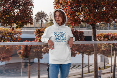 Pullover Hoodie Mockup of a Woman Standing in Front of Autumn Trees 4777-el1