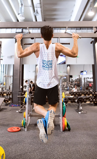 Tank Top Mockup of a Man Doing Pull-Ups at the Gym