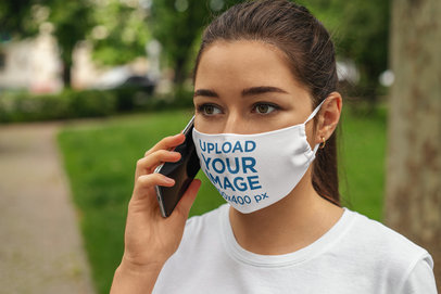 Face Mask Mockup Featuring  a Woman on the Phone 