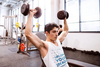 Tank Top Mockup of a Man Lifting a Pair of Dumbbells