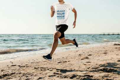 T-Shirt Mockup of a Man Running Featuring the Sea in the Background
