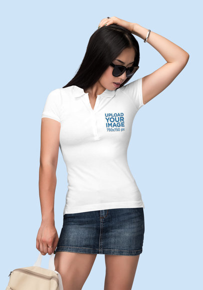 Mockup of a Woman With Sunglasses Wearing a Polo Shirt at a Studio 
