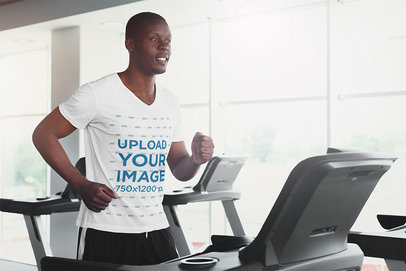 V-Neck T-Shirt Mockup of a Man Running on a Treadmill