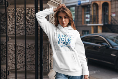 Hoodie Mockup of a Trendy Woman Leaning on a Building Gate 4782-el1