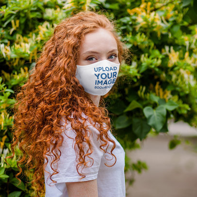 Face Mask Mockup Featuring a Curly-Haired Woman 