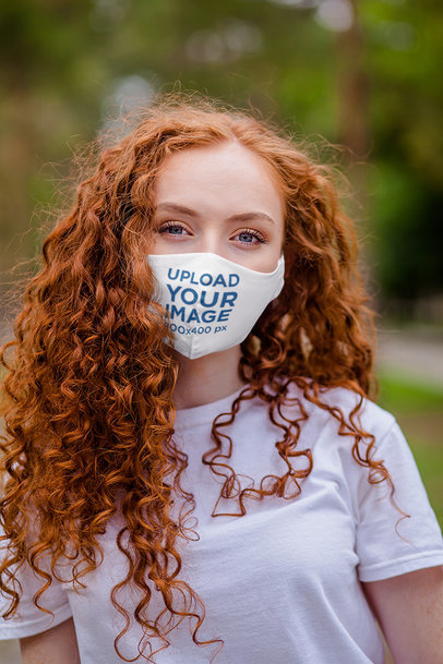Mockup of a Curly-Haired Woman Wearing a Face Mask