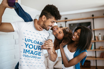T-Shirt Mockup of a Father Playing with His Kid and Wife