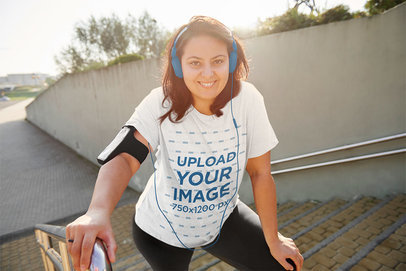 Activewear Mockup of a Woman Wearing a T-Shirt and Posing on a Staircase 