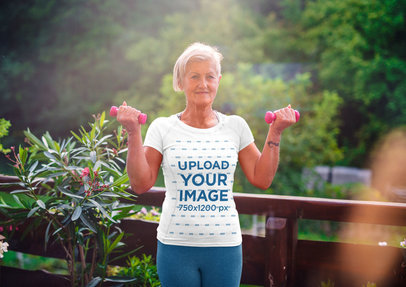 Jersey Mockup of a Senior Woman Lifting Lightweight Dumbbells 