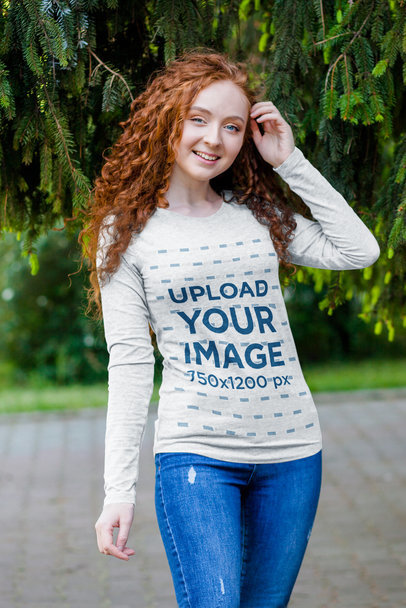 Long Sleeve T-Shirt Mockup of a Curly-Haired Woman Posing by a Tree 